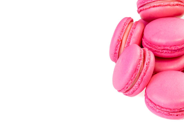 istock Pink macarons or macaroons in the black box. Background with Copy space or place for text. 1128031594