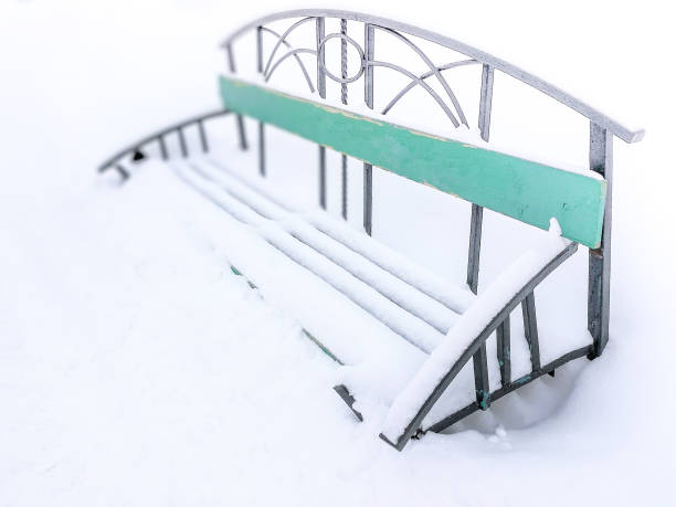 istock Winter park with snow covered bench. Consequences of heavy snowfall 1128034515