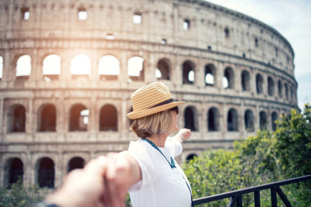 istock Couple by the Colosseum in Rome 1128037648