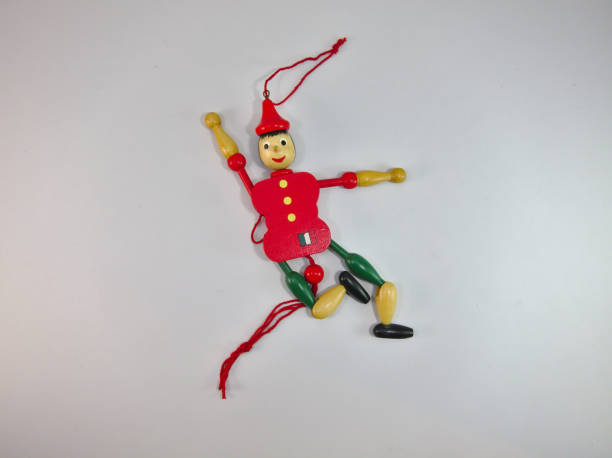 istock Puppet Old wood Green and red. 1128039601