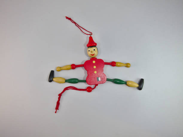 istock Puppet Old wood Green and red. 1128039887