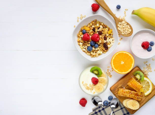 istock Healthy breakfast on white wooden background 1128039925