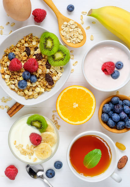 istock Healthy breakfast on white wooden background 1128039982