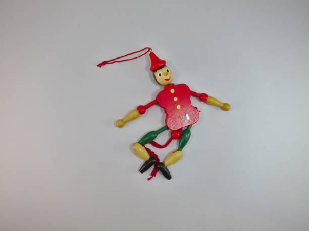 istock Puppet Old wood Green and red. 1128039995