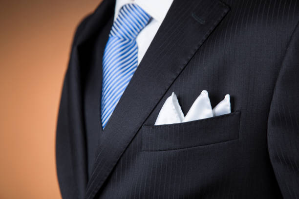 detail of a silk pocket handkerchief with an elegant outfit stock photo