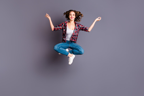 Full length size body view photo jumping high amazing attractive she her lady lotus pose dreamy dream inspired imagination wearing casual jeans denim checkered plaid shirt grey background