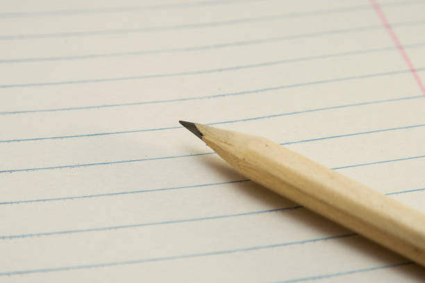 istock One Sharpened Yellow Pencil on a Diagonal with a Paper Background 1128042177