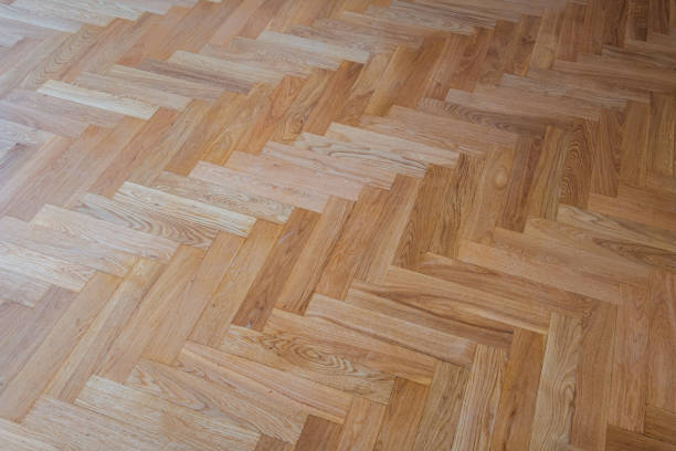 istock parquet floor background - heringbone parquet flooring 1128044531
