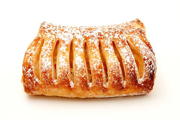 Apple strudel on white background An apple strudel on a white background apple strudel stock pictures, royalty-free photos & images