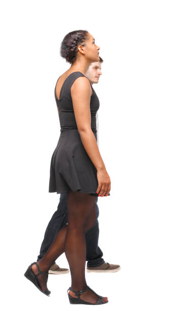 istock Side view of interracial going couple. 1128048122
