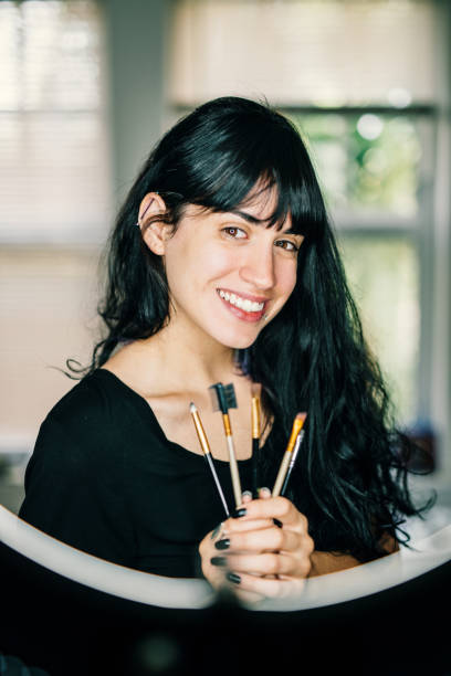 istock Millennial generation Latina promoting her make up business 1128049686