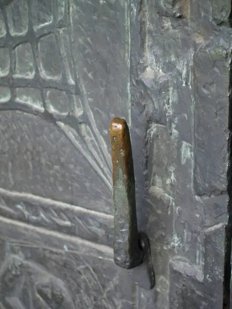 old worn door handle on a church