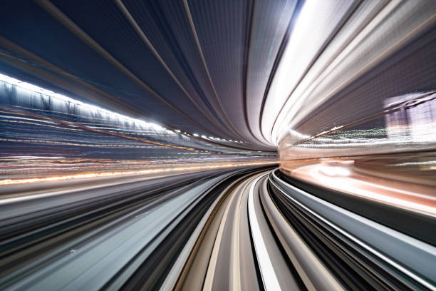 istock Motion blur of train moving inside tunnel with daylight in tokyo, Japan. 1128049849