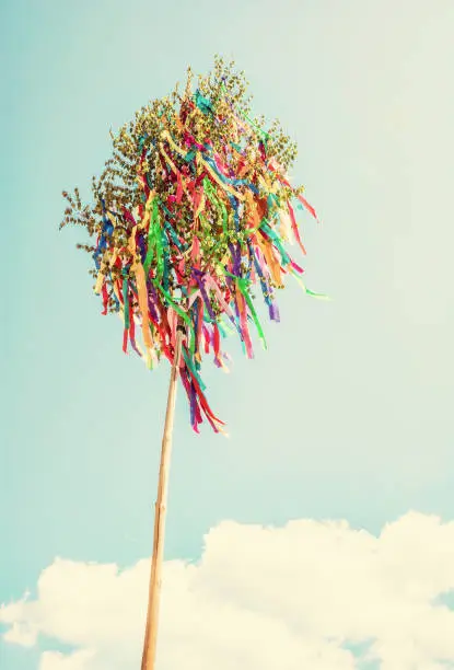 Looking up at may pole. Symbolic object. Retro photo filter.