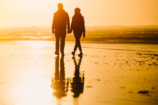 istock Loving Mature Couple Silhoutte At Oregon Coast 1128050136