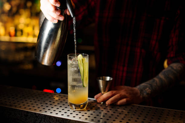 istock Bartender pouring a soda to a Lynchburg lemonade cocktail from the siphon 1128052744