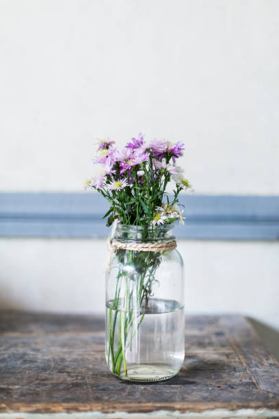 istock Wild flowers bouquet on a table 1128054410