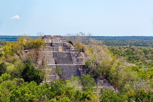 View of the pyramid known as structure one rising above the rain forest in Calakmul, Mexico