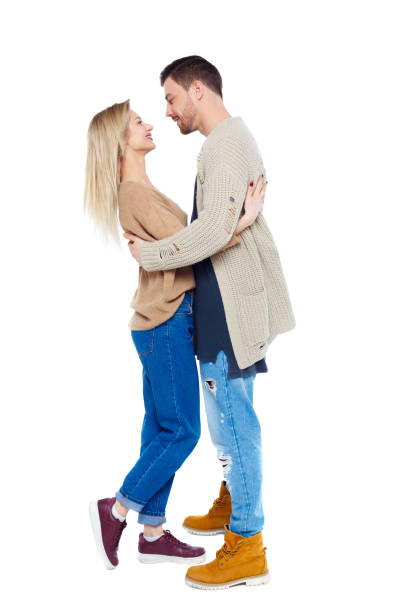 istock Back view of a stylish couple. 1128054588