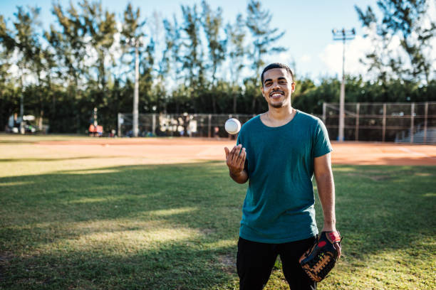 Latino baseball player exercising pitching in USA