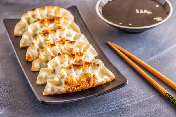 istock Gyoza or dumplings snack with soy sauce, selective focus 1128055669