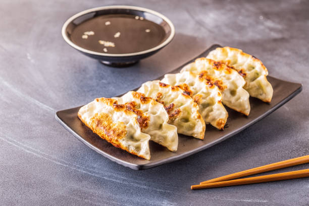 istock Gyoza or dumplings snack with soy sauce, selective focus 1128055674