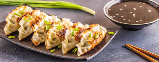 istock Gyoza or dumplings snack with soy sauce, selective focus 1128055688