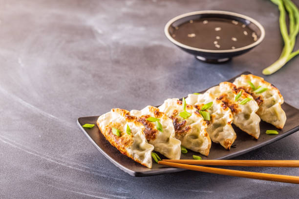 Gyoza or dumplings snack with soy sauce, selective focus