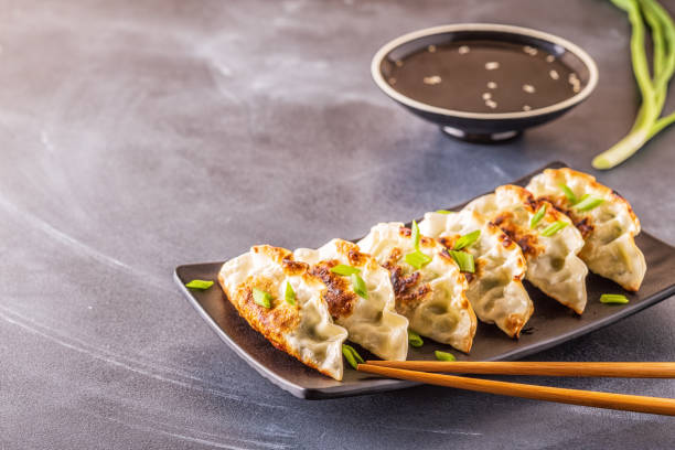 Gyoza or dumplings snack with soy sauce, selective focus stock photo