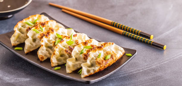 istock Gyoza or dumplings snack with soy sauce, selective focus 1128055729