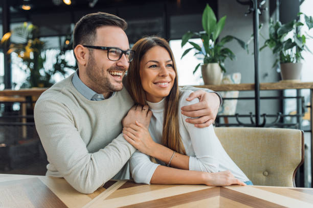 Couple having fun at coffee house. stock photo