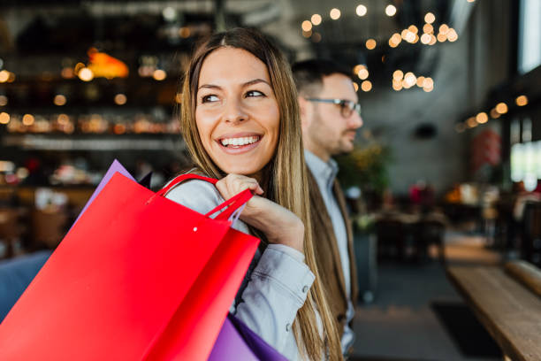 istock Young couple in shopping 1128056103