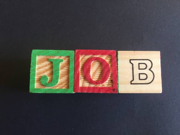 istock Word Job composed by wooden cubes on black background 1128056243