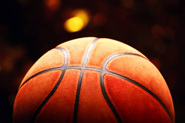istock basketball ball gold bokeh 1128056440