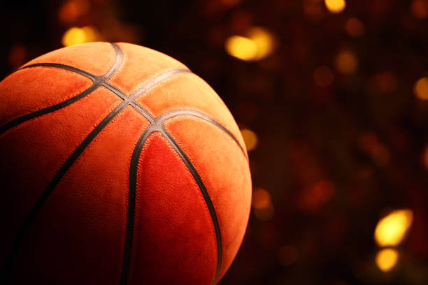 istock basketball ball gold bokeh 1128056442