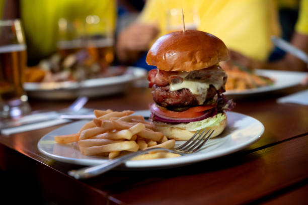 istock Close-up on a cheese burger served at a sports bar 1128064169