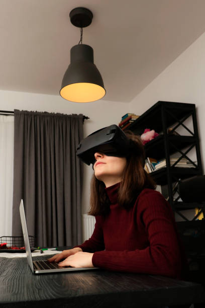 istock Woman wearing VR Glasses 1128064536