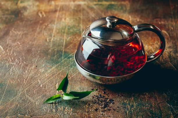 istock Transparent glass teapot black tea and glass cups 1128065509