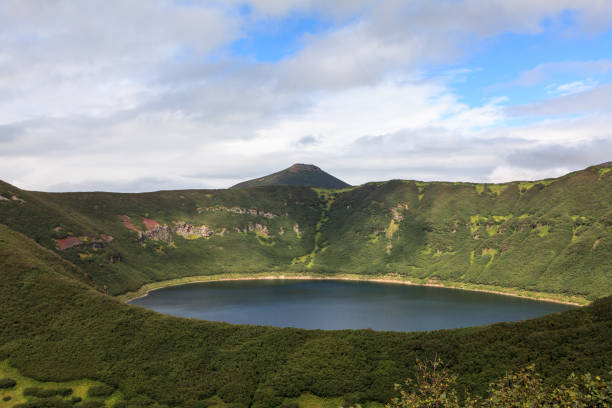 istock Small round lake inside the mountains. Kamchatka Peninsula, Russia 1128066078