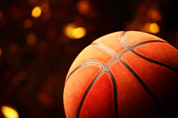 istock basketball ball gold bokeh 1128066251