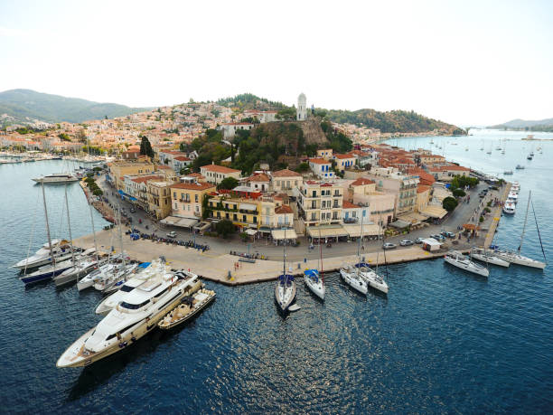 Sailing ships in harbor of Poros Island, Greece.