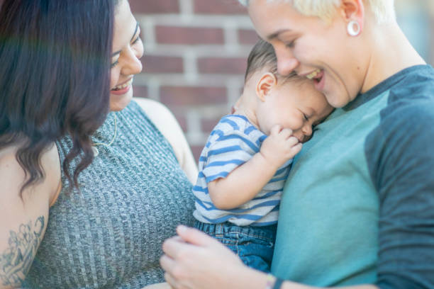 istock LGBTQ family cuddling 1128072108
