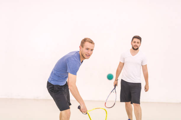 istock Two college buddies playing racquetball 1128072716