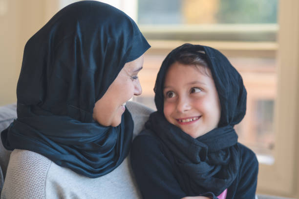 istock Arab-American mother embraces her young daughter 1128072744