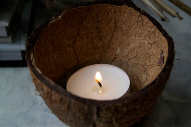istock Candle in the coconut skin. 1128073345