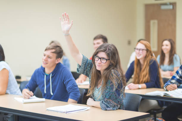 istock College students asking questions in the classroom 1128073860