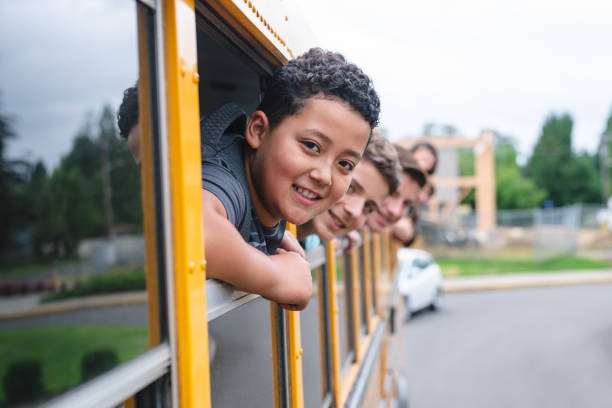 istock Portrait of elementary students in school bus 1128074007