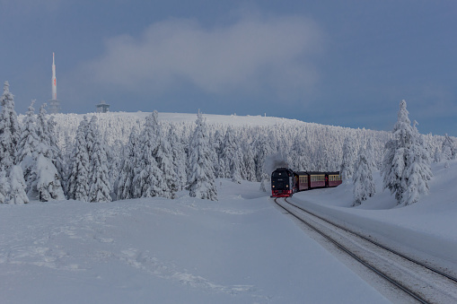 on the way in the winter landscape through the beautiful harz