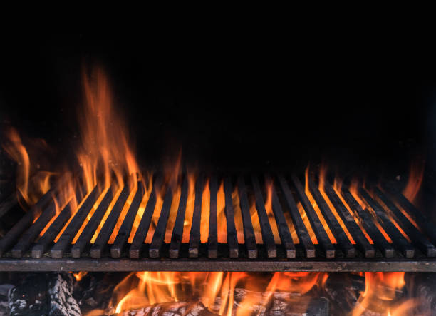 istock Empty grill grate and tongues of fire flame. 1128075346