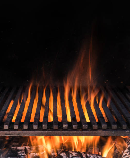 istock Empty grill grate and tongues of fire flame. 1128075347
